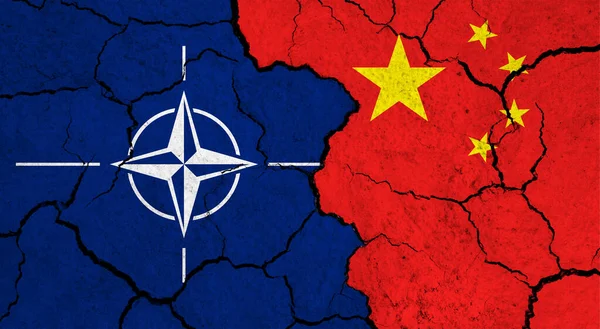 stock image Flags of NATO and China on cracked surface - politics, relationship concept