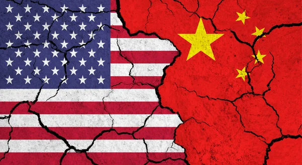 Flags of Usa and China on cracked surface - politics, relationship concept