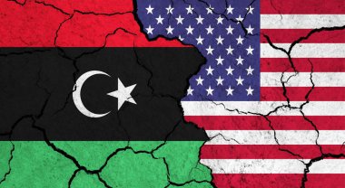 Çatlak yüzey üzerinde Libya ve ABD bayrakları - siyaset ve ilişki kavramı