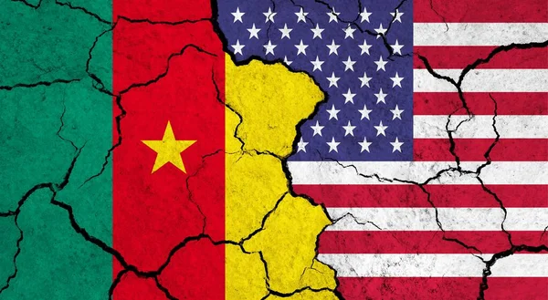 Flags of Cameroon and USA on cracked surface - politics, relationship concept
