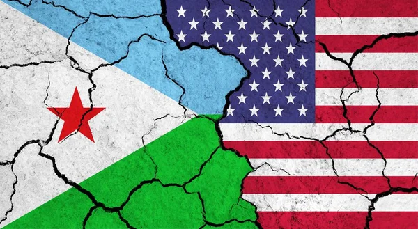 Flags of Djibouti and USA on cracked surface - politics, relationship concept