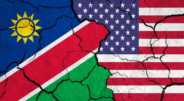 Flags of Namibia and USA on cracked surface - politics, relationship concept