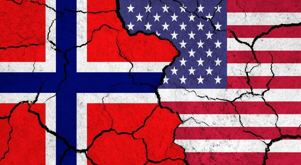 Flags of Norway and USA on cracked surface - politics, relationship concept