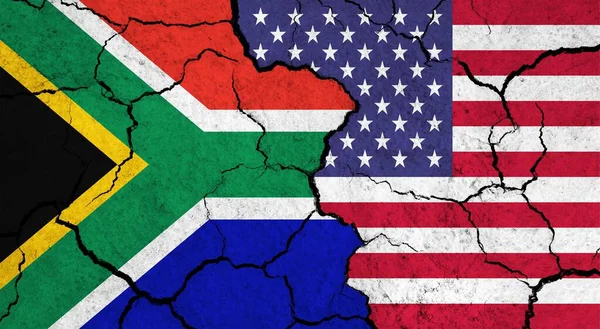 Flags of South Africa and USA on cracked surface - politics, relationship concept