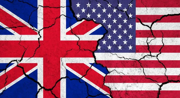 Flags of UK and USA on cracked surface - politics, relationship concept