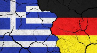 Yunanistan ve Almanya 'nın bayrakları çatlak yüzeyde - siyaset ve ilişki kavramı