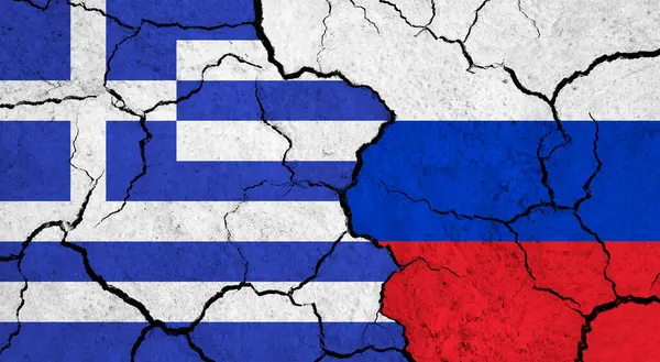 Flags of Greece and Russia on cracked surface - politics, relationship concept