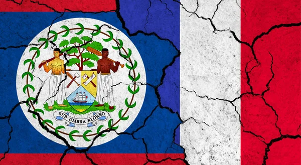 Flaggen Von Belize Und Frankreich Auf Rissiger Oberfläche Politik Beziehungskonzept — Stockfoto