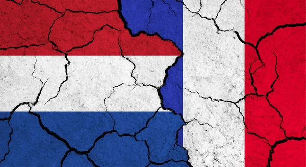 Прапори Нідерландів Франції Тріснутій Поверхні Політика Концепція Відносин — стокове фото