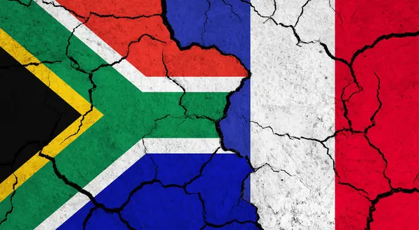 Flags of South Africa and France on cracked surface - politics, relationship concept