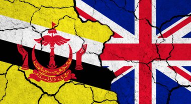 Kırık yüzey üzerinde Brunei ve Birleşik Krallık bayrakları - politika, ilişki konsepti