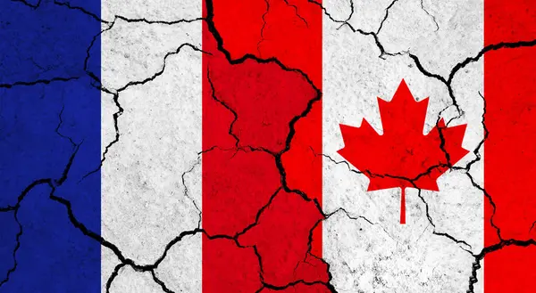 Flags of France and Canada on cracked surface - politics, relationship concept