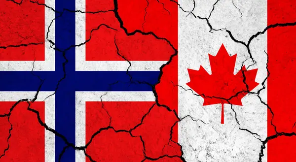 Flags of Norway and Canada on cracked surface - politics, relationship concept
