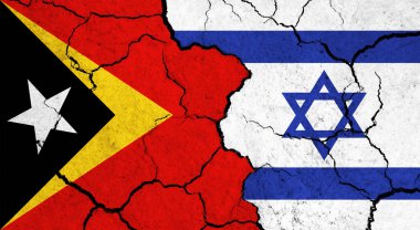Çatlak yüzeyde Doğu Timor ve İsrail 'in bayrakları - politika, ilişki konsepti