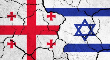 Çatlak yüzey üzerine Gürcistan ve İsrail bayrakları - politika ve ilişki kavramı