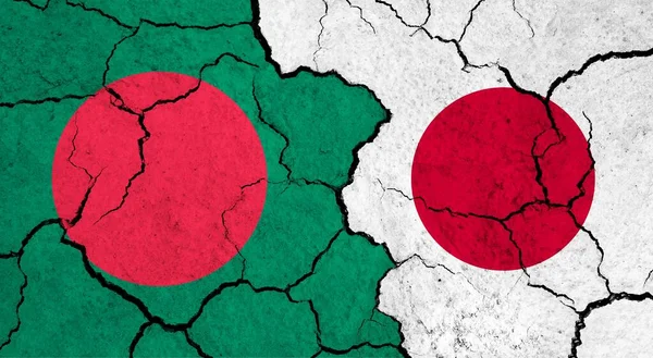 Flags of Bangladesh and Japan on cracked surface - politics, relationship concept