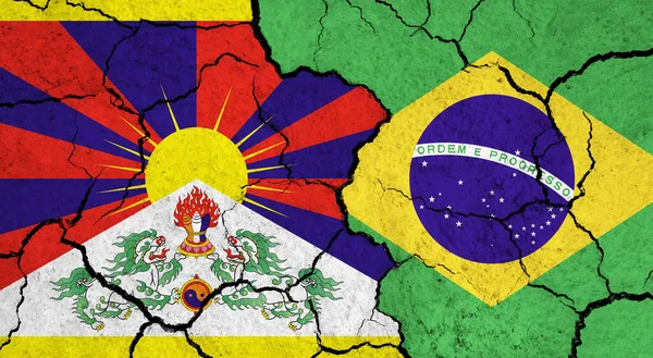 Flags of Tibet and Brazil on cracked surface - politics, relationship concept