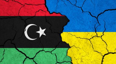 Çatlak yüzeyde Libya ve Ukrayna bayrakları - siyaset, ilişki konsepti