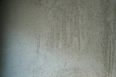 Gri, sert beton duvar yüzeyi