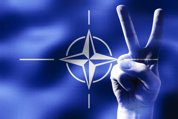 NATO - two fingers showing peace sign and national flag