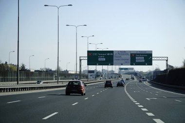 Warsaw, Poland - March 10th, 2024 - Information board on S2 expressway - view from driver's perspective clipart