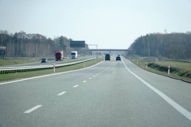 Minsk Mazowiecki, Poland - March 10th, 2024 - A2 highway from driver's perspective clipart