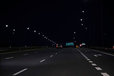 Warsaw, Poland - March 10th, 2024 - Information board on S2 expressway - night photograph clipart