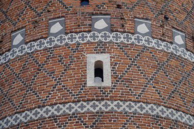 Ciechanow, Poland - June 8th, 2024 - Round tower with decorational pattern at Castle of the Masovian Dukes clipart