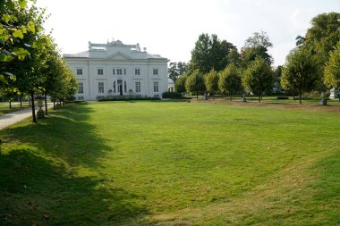 Trakai, Lithuania - September 13th 2023 - Uzutrakis Manor, Tyszkiewicz family palace - view from the garden side clipart