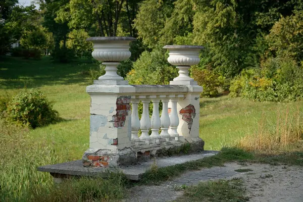 stock image Trakai, Lithuania - September 13th 2023 - Stone flower pots on bridge in park - Uzutrakis Manor, Tyszkiewicz family residence