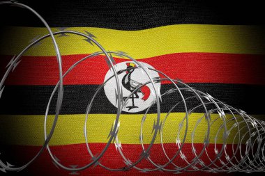 Spiral dikenli tel ve Uganda bayrağı - 3 boyutlu illüstrasyon