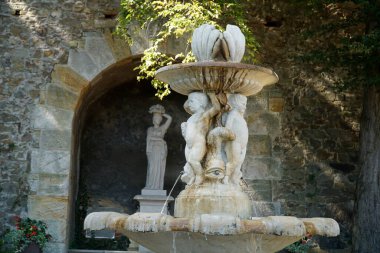 Walbrzych, Poland - August 12th, 2024 - Fountain in garden at Ksiaz Castle clipart