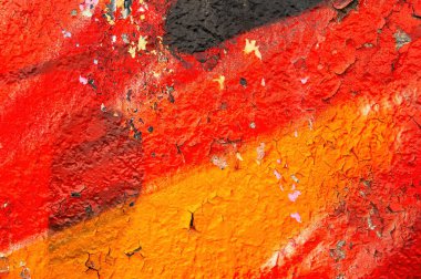 Boyalı yüzeyin dokusu kırmızı ve siyah tonlarda. Çok renkli arkaplan resmi. Soyut renkli arkaplan. Yaşlanma sürecini boya. Profesyonel ressam. Metin için şablon.