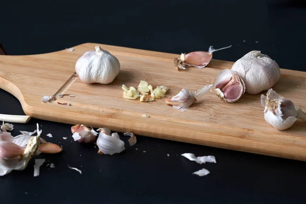 Chopped garlic on the kitchen board.