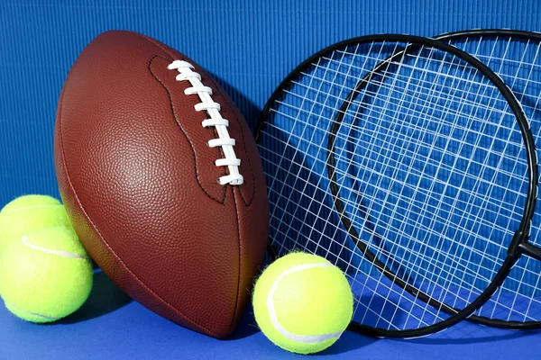 Badminton Rackets Tennis Balls Basketball Ball Blue Background — Stok fotoğraf