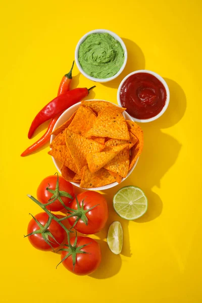 Concept of tasty snacks, corn chips, top view