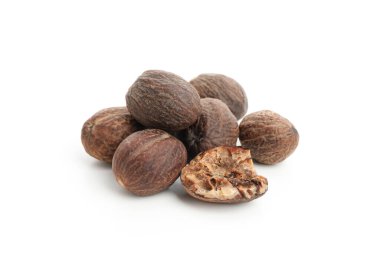 Concept of spices and condiments, nutmegs, isolated on white background