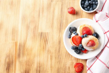 Concept of tasty sweet food, cheese pancakes, space for text