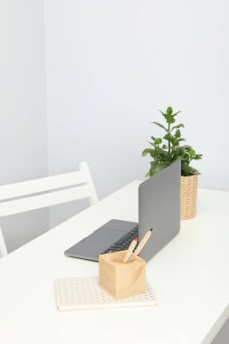 Concept of workspace with laptop, space for text
