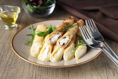 Concept of tasty food, thin pancakes with filling