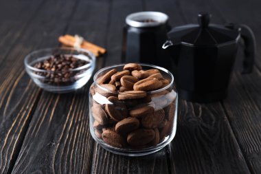 Concept of tasty snack for hot drink - cookies in the shape of coffee seeds