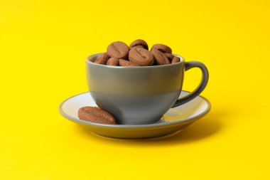 Concept of tasty snack for hot drink - cookies in the shape of coffee seeds