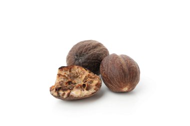 Concept of spices and condiments, nutmegs, isolated on white background