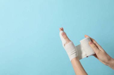 Concept of hand injury help with elastic bandage