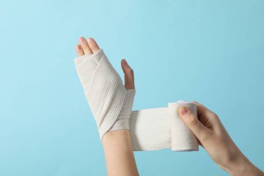 Concept of hand injury help with elastic bandage