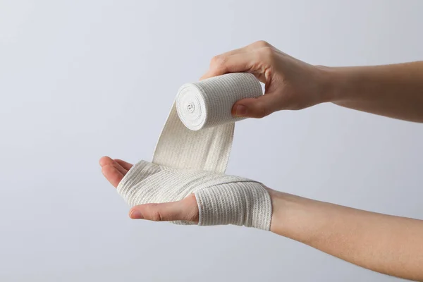 stock image Concept of hand injury help with elastic bandage