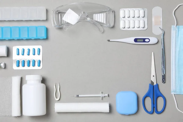 First aid kit supplies on gray background
