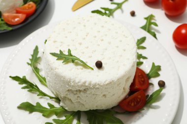 Concept of tasty dairy product - ricotta cheese