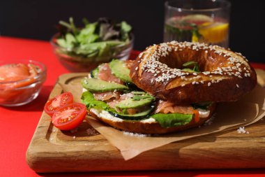 Concept of delicious food - tasty bagel sandwich