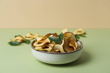 Concept of tasty food, dried apple chips, space for text